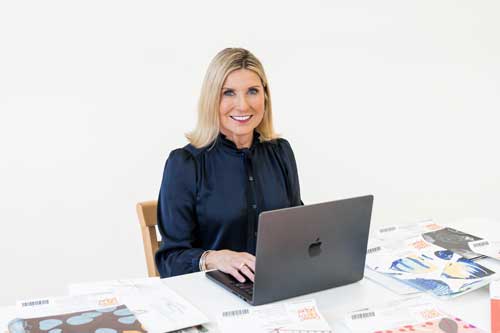 Joanie O'Connor at laptop